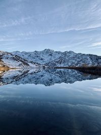 Scenic view of snowcapped mountains against sky