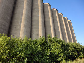 Low angle view of factory against clear sky