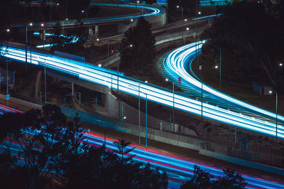 High angle view of light trails on road at night