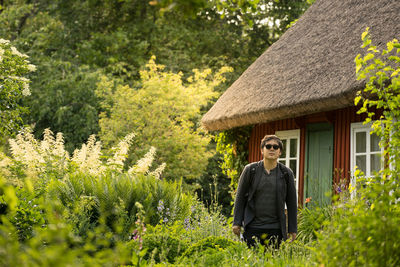 Man standing by plants