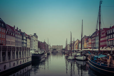 Boats moored at harbor