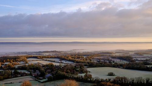 Aerial view of townscape against sky during sunset