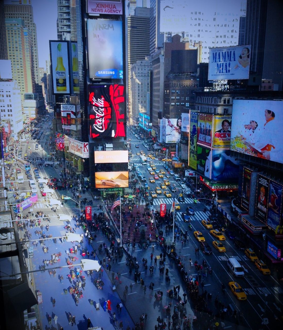 building exterior, city, architecture, built structure, large group of people, street, city life, city street, land vehicle, car, transportation, high angle view, illuminated, road, person, lifestyles, crowd, men, traffic