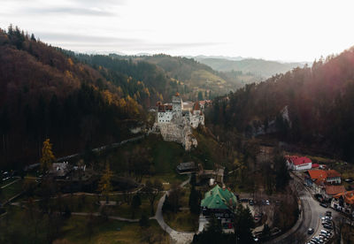 Bran castle on mountain against sky