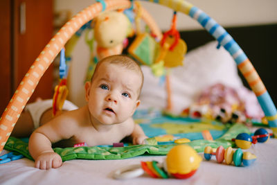 Portrait of cute baby toy at home