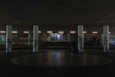 Man and woman in illuminated room