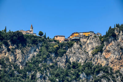 Low angle view of buildings against blue sky