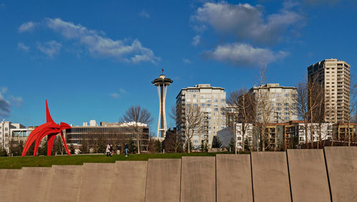 Buildings against cloudy sky