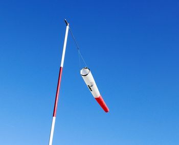 Low angle view of pole against clear blue sky