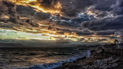 Scenic view of sea against dramatic sky