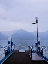 Scenic view of pier and sea against sky