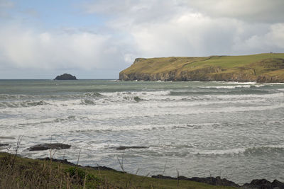 Scenic view of sea against cloudy sky