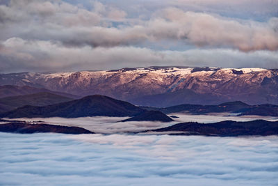 Scenic view of snowcapped mountains against sky