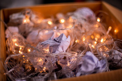 Close-up of illuminated christmas lights in box