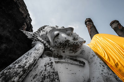 Low angle view of statue against sky
