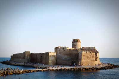 Historic fort le castella, calabria, italy against clear sky