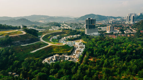 High angle view of buildings in city against sky