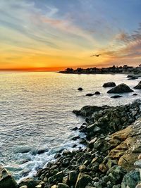 Scenic view of sea against sky during sunset