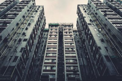 Low angle view of buildings in city against sky