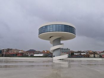 View of modern buildings in city against sky