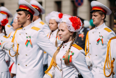 People in traditional clothing standing in store