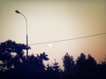 Low angle view of street light against sky