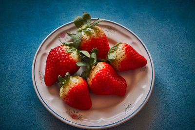 High angle view of strawberries in bowl on table