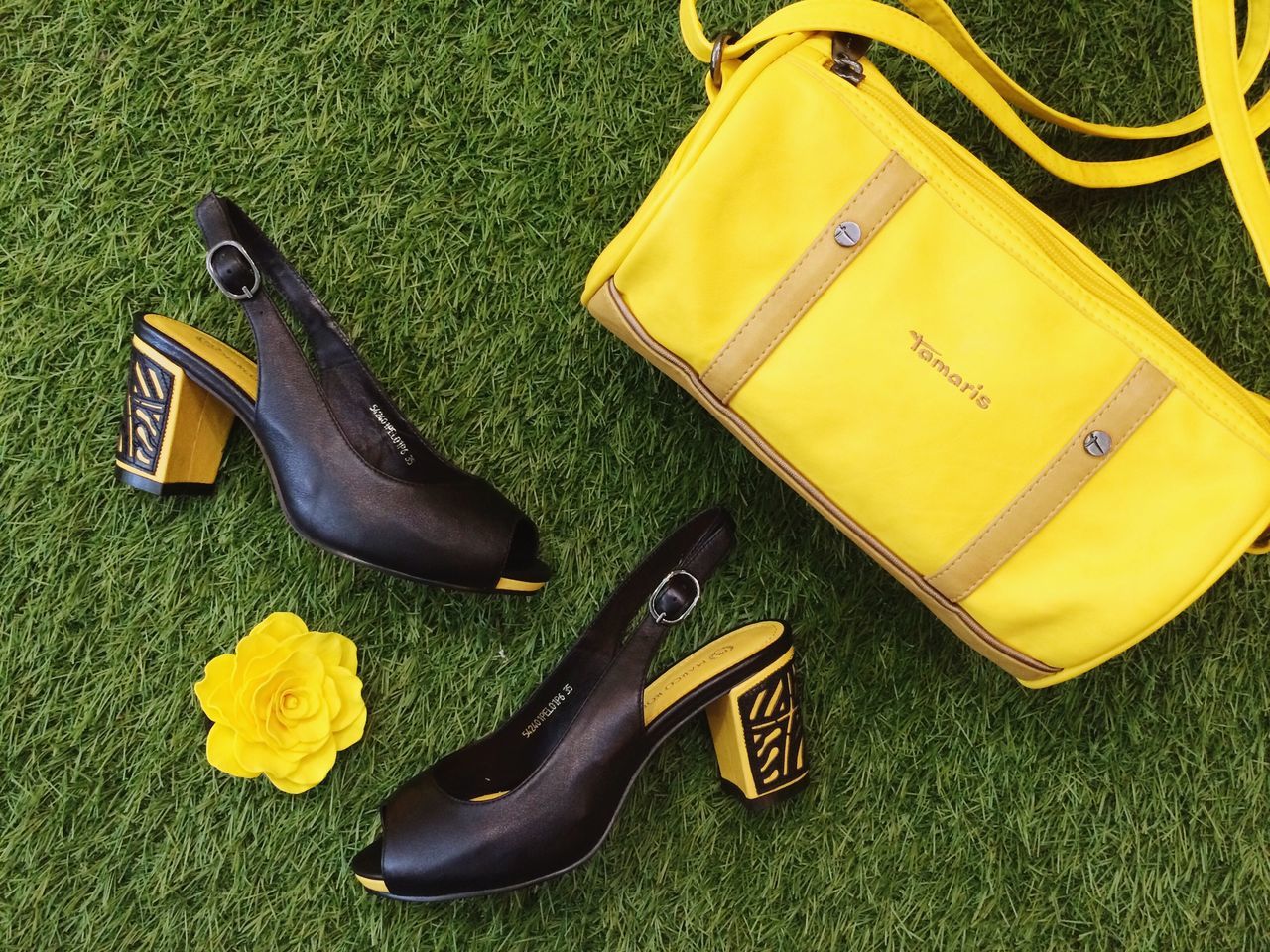 yellow, high angle view, shoe, footwear, still life, pair, low section, table, close-up, person, two objects, absence, day, metal, indoors, no people, shadow, relaxation, childhood