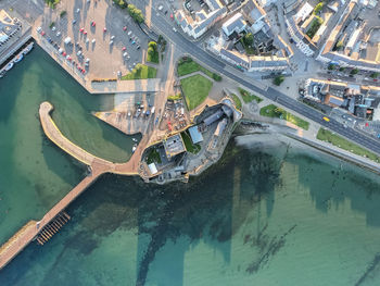 High angle view of city by sea