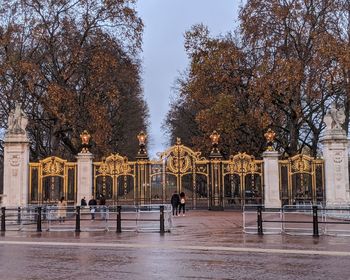 People walking on wet street near hyde park