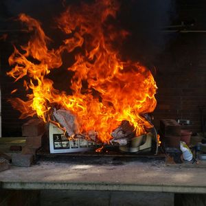 Papers burning in kitchen of abandoned house