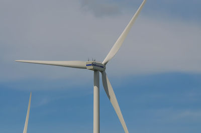 Low angle view of wind turbine against sky