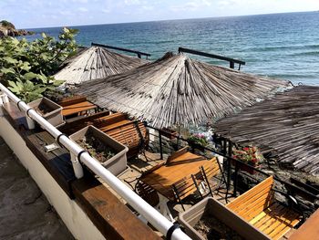 High angle view of deck chairs on beach