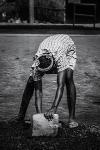 Full length of farmer working in farm