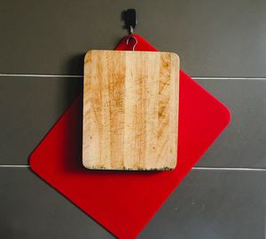 Close-up of cutting board hanging from wall