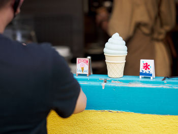 Cropped hand of woman holding ice cream