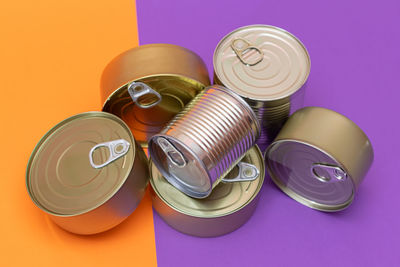 High angle view of containers on yellow background