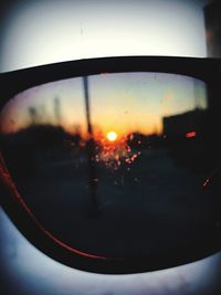 View of sunset through car window