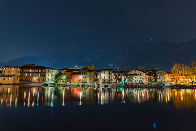 Reflection of illuminated buildings in water at night