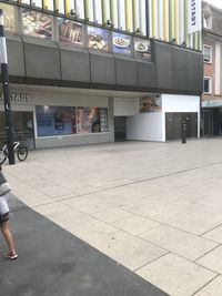 Low section of woman walking on tiled floor