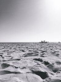 Scenic view of beach against clear sky