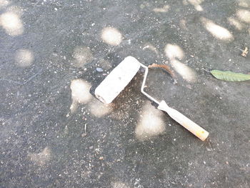 High angle view of broken sign on street