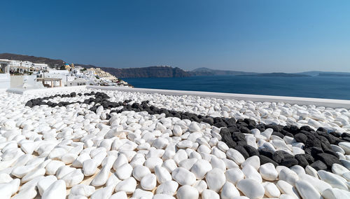 Scenic view of sea against clear blue sky