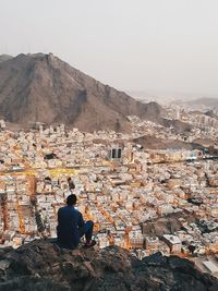 Man looking at cityscape