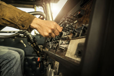 Midsection of man working in workshop