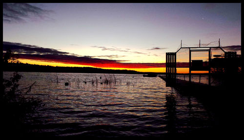 Scenic view of sea at sunset