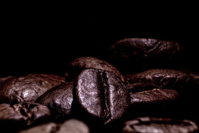 Close-up of coffee beans against black background