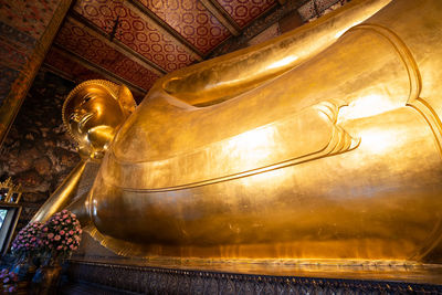 Low angle view of buddha statue in temple