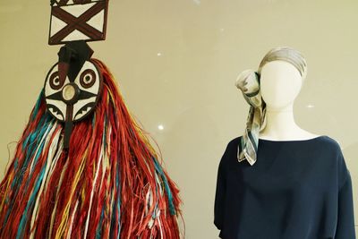 Midsection of man with umbrella standing at night