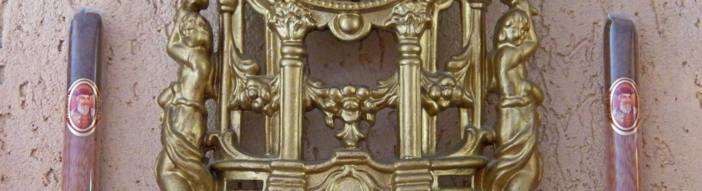 Close-up of ornate door on wall of building